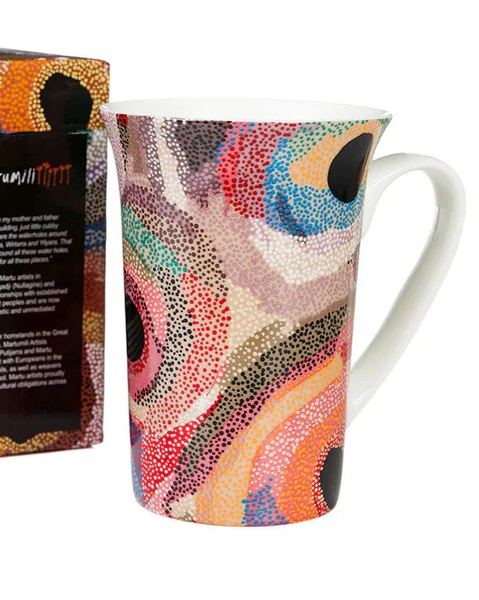 Colorful mug with abstract design and matching box on a white background