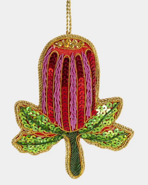 Decorative ornament with red and green design on a white background