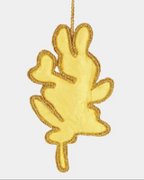 Gold leaf-shaped ornament on a white background