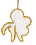Decorative white and gold leaf-shaped ornament on a white background