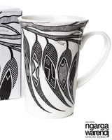Mug with black and white design and packaging featuring 'ngarga warendj' branding on a white background.
